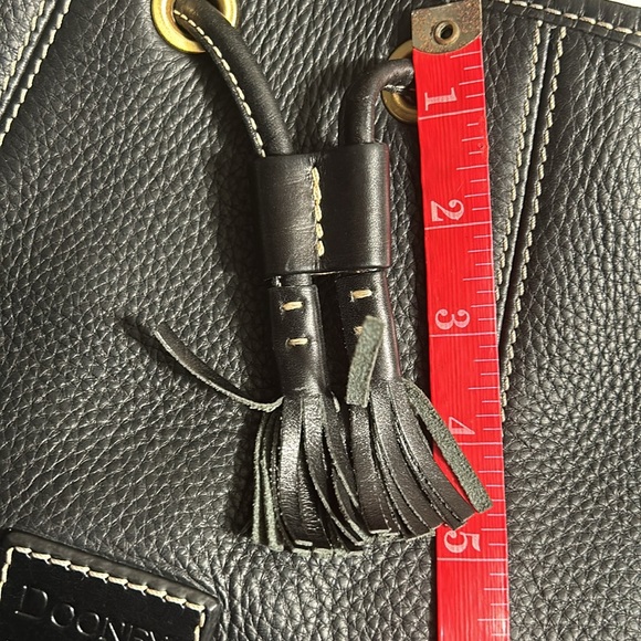 Dooney & Bourke Drawstring bag with tassels and duck tag. - Picture 5 of 12